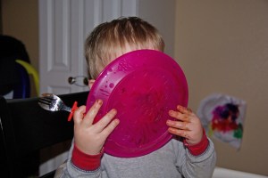 Kid with face in plate making a mess